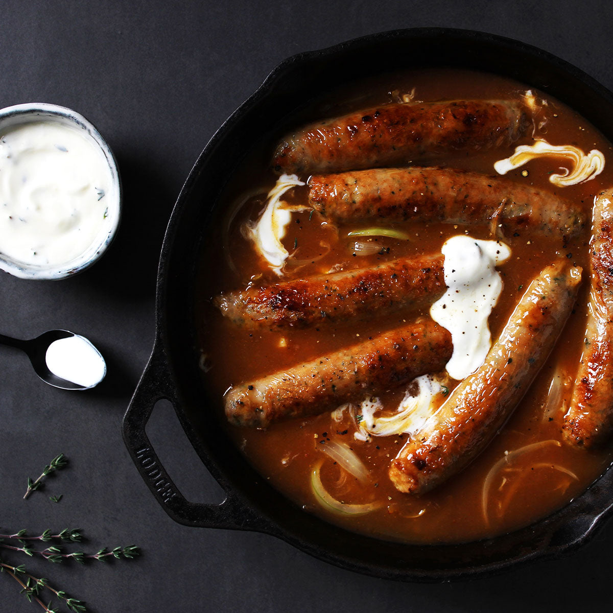 Curried sausages with lemon thyme yogurt dressing